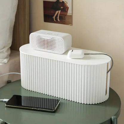 Stilren kabelorganiseringsboks i moderne design, perfekt til at holde dine kabler skjult og organiseret i hjemmet.