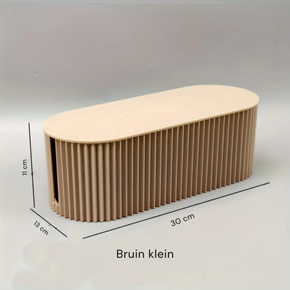 Stilren kabelorganiseringsboks i moderne design, perfekt til at holde dine kabler skjult og organiseret i hjemmet.