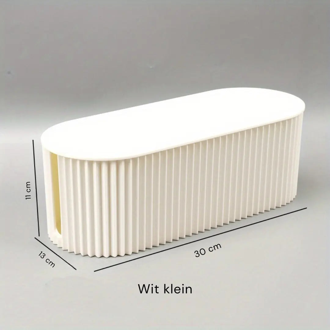 Stilren kabelorganiseringsboks i moderne design, perfekt til at holde dine kabler skjult og organiseret i hjemmet.