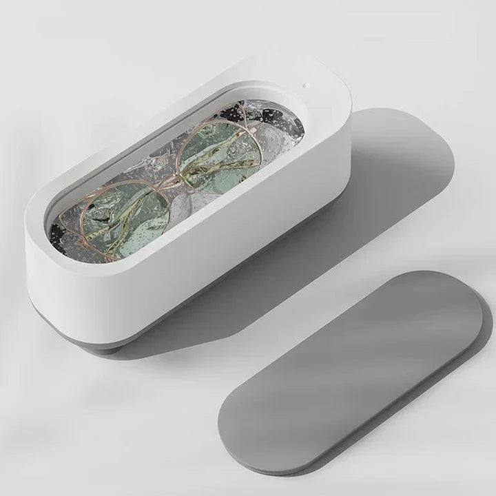 "Ultralydsrens til briller med højfrekvensteknologi, kompakt design, effektiv i 3 min, renser fedt og støv grundigt."