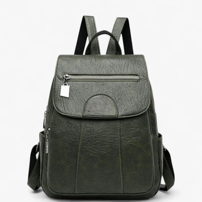 "Vintage læder rygsæk i blødt brun læder med polstrede stropper og rummelig indretning, perfekt til stilfulde rejser."