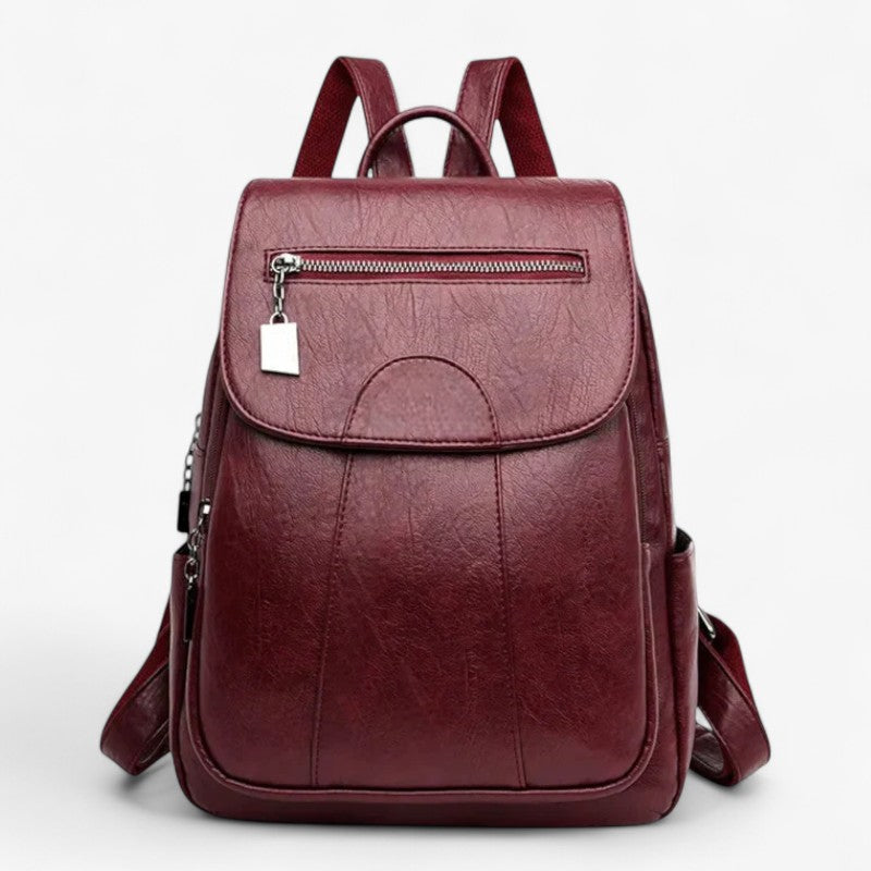 "Vintage læder rygsæk i blødt brun læder med polstrede stropper og rummelig indretning, perfekt til stilfulde rejser."