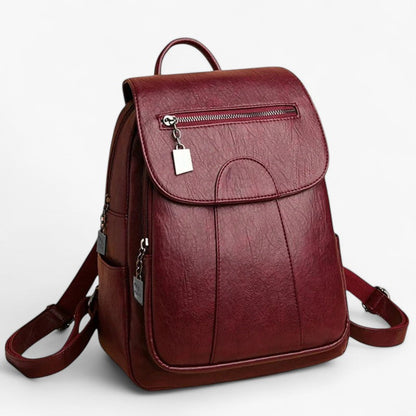 "Vintage læder rygsæk i blødt brun læder med polstrede stropper og rummelig indretning, perfekt til stilfulde rejser."